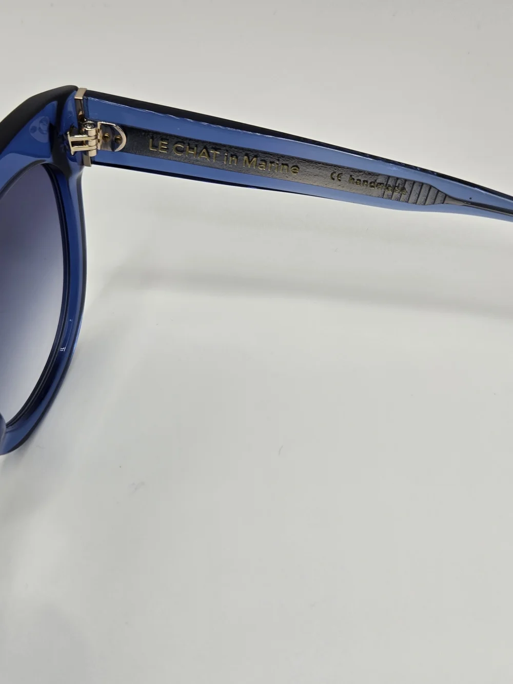 Aperçu sunglasses featuring a bold acetate frame and gold tone branding